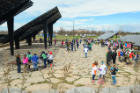 Middle school students break into groups to learn about UB's Solar Strand on Earth Day. Photo: Nancy J. Parisi
