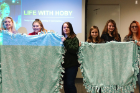 Students created blankets to donate to local refugee centers.