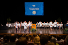 The Jacobs School of Medicine and Biomedical Sciences welcomed its largest class ever — 180 students — at the white coat ceremony in the Center for the Arts Mainstage theater. 