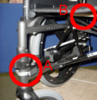 Figure 4: Positioning of Right Assembly from the front of the wheelchair. Mounting Bracket is marked with an A, Wooden Roller with a B. 