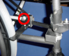 Figure 7: Completed plastic slider assembly shown from the side of the wheelchair (Spring placement on plastic slider circled). 