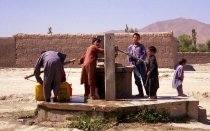 Children collecting water from a well. 