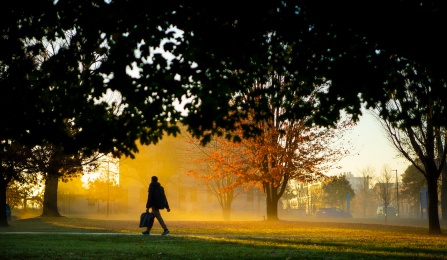 Student walking in the morning on UB's south campus. 